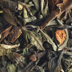White and green Christmas tea with cinnamon and orange.
